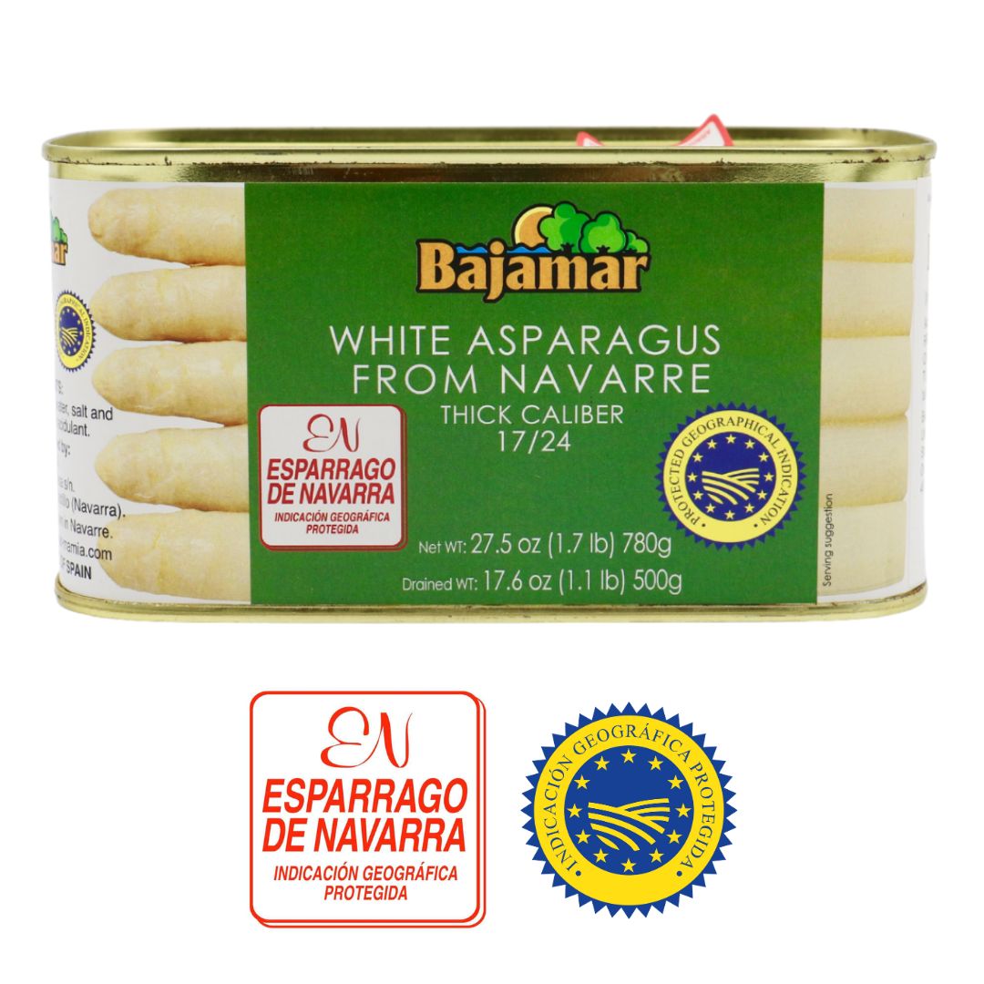 A can of Bajamar White Asparagus from Navarre presents a premium Spanish delicacy. Packed vertically, the thick spears (caliber 17/24) peek through on either side of the clean green label. Certifications of Protected Geographical Indication (PGI) and “Espárrago de Navarra” ensure authenticity and regional pride. With a net weight of 780g and a drained weight of 500g, this is a generous, high-quality offering ready for elegant plating.