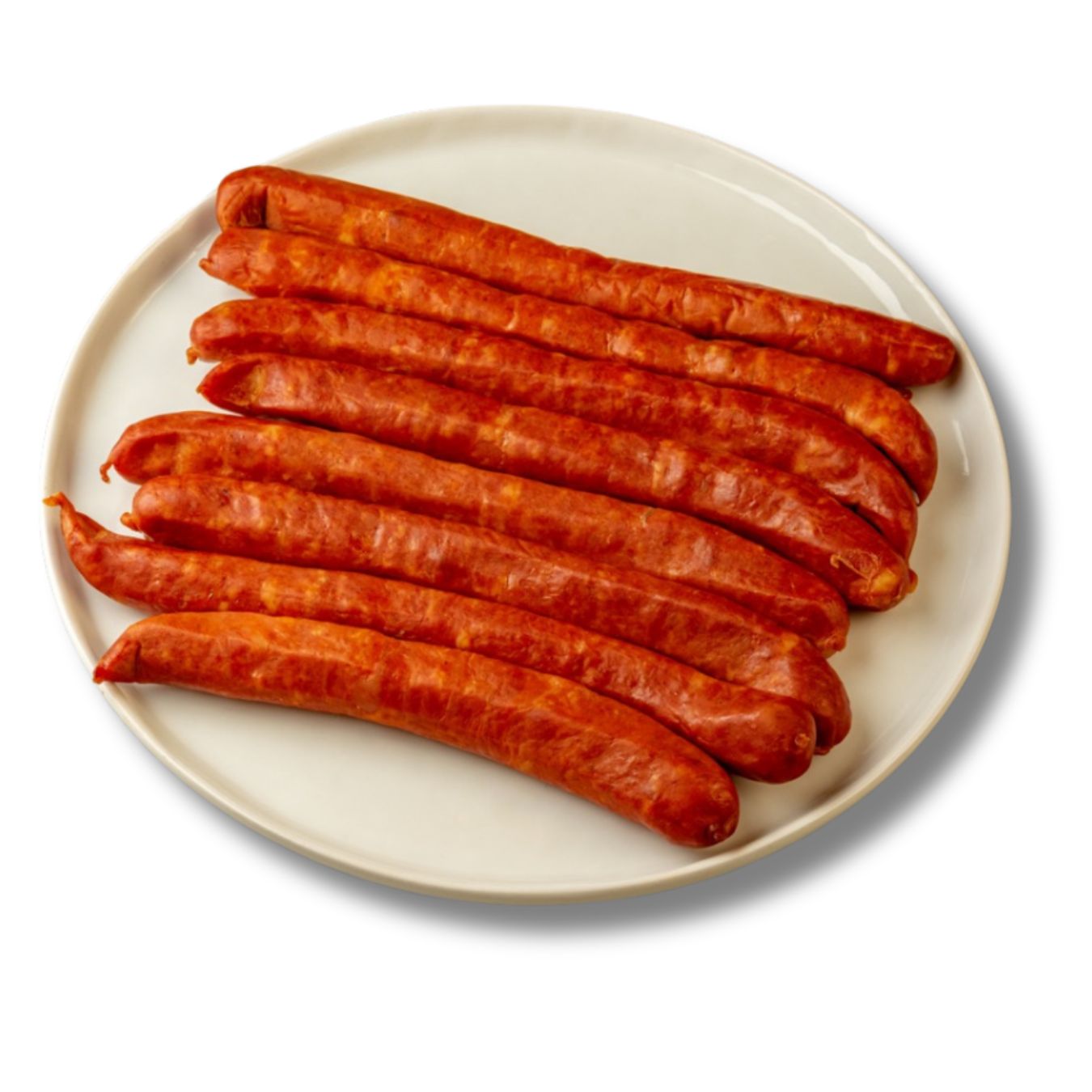 A plate of Spanish chistorra sausages laid out on a white ceramic dish. These thin, vibrant red sausages are rich in paprika and garlic, known for their bold flavor and ideal for grilling or frying. Traditional Basque-style cured meat.