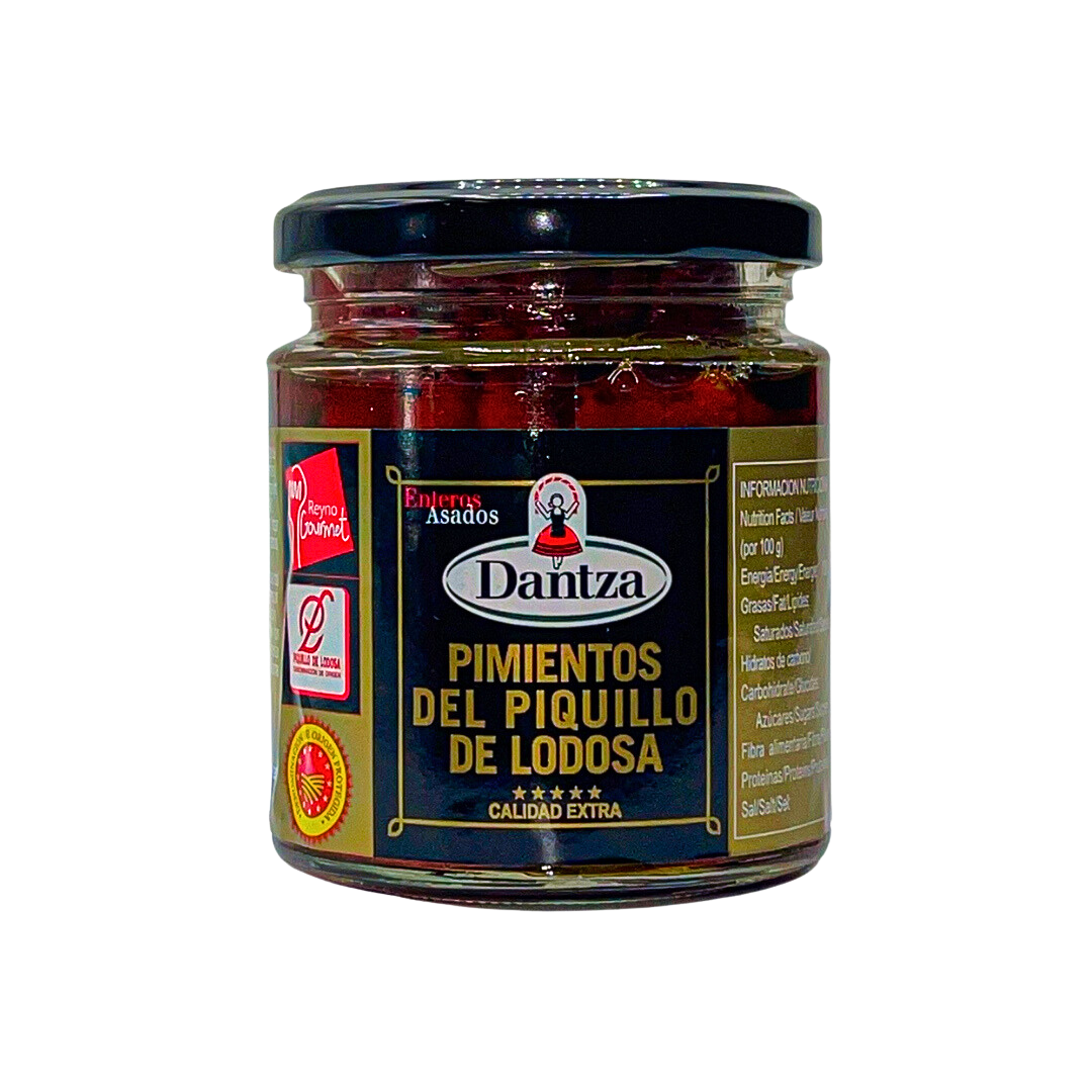 A premium jar of roasted Piquillo peppers from Lodosa by Dantza, showcasing the D.O. certification for authenticity and quality. These whole peppers offer a sweet, smoky flavor ideal for tapas, stuffing, or gourmet Spanish recipes.