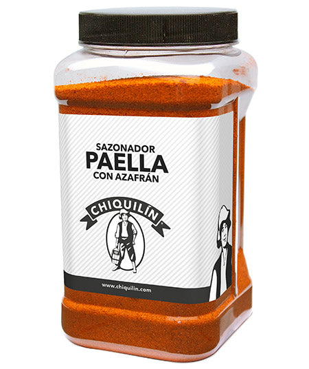 Large plastic container of Chiquilín Sazonador Paella con Azafrán, filled with vibrant orange paella seasoning. Designed for professional kitchens, the label features a traditional Spanish figure and bold black cap. Ideal for flavoring authentic Spanish rice dishes.