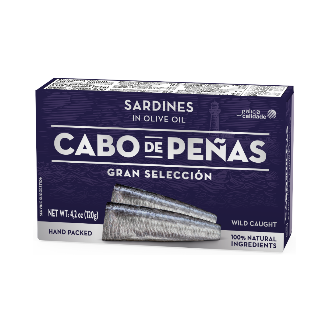A premium box of Cabo de Peñas Gran Selección sardines, hand-packed and wild-caught, preserved in olive oil. Featuring a sleek navy design, this gourmet Spanish seafood product emphasizes 100% natural ingredients and the authenticity of Galicia’s coastal tradition.