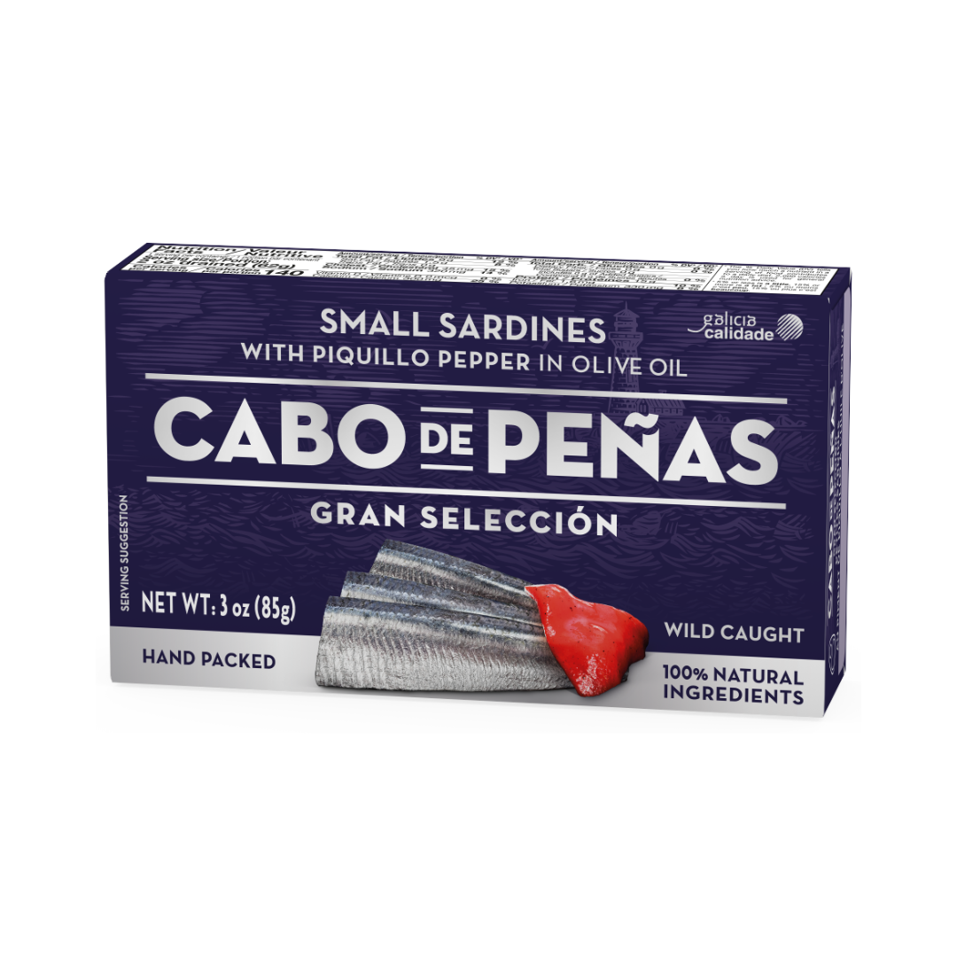 Cabo de Peñas Gran Selección tin of small wild sardines with piquillo pepper in olive oil. The vibrant packaging highlights premium quality, hand-packed ingredients, and the bold Spanish flavor combination of tender fish and sweet pepper.