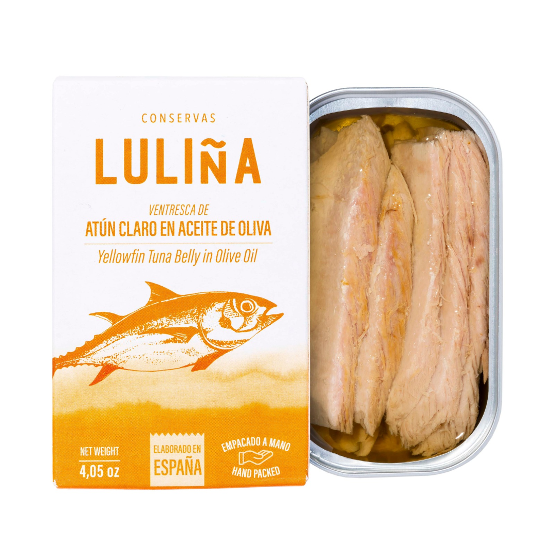 The Luliña tin opens to reveal thick, glistening fillets of yellowfin tuna belly nestled in golden olive oil.