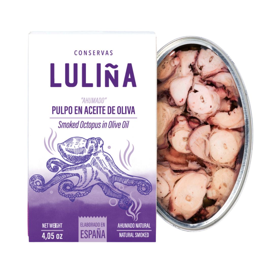 A tin of Conservas Luliña smoked octopus in olive oil, showing tender octopus slices immersed in golden oil beside its purple and white box. The packaging features a detailed octopus illustration and highlights its artisanal Spanish origin and natural smoked flavor.