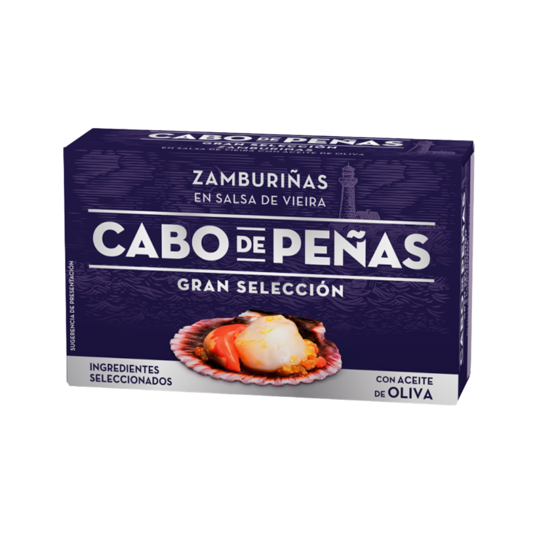 Box of Cabo de Peñas Zamburiñas en Salsa de Vieira, featuring Galician small scallops in a rich scallop sauce with olive oil. The dark purple packaging showcases a vivid image of a scallop on its shell, highlighting premium Spanish seafood tradition.