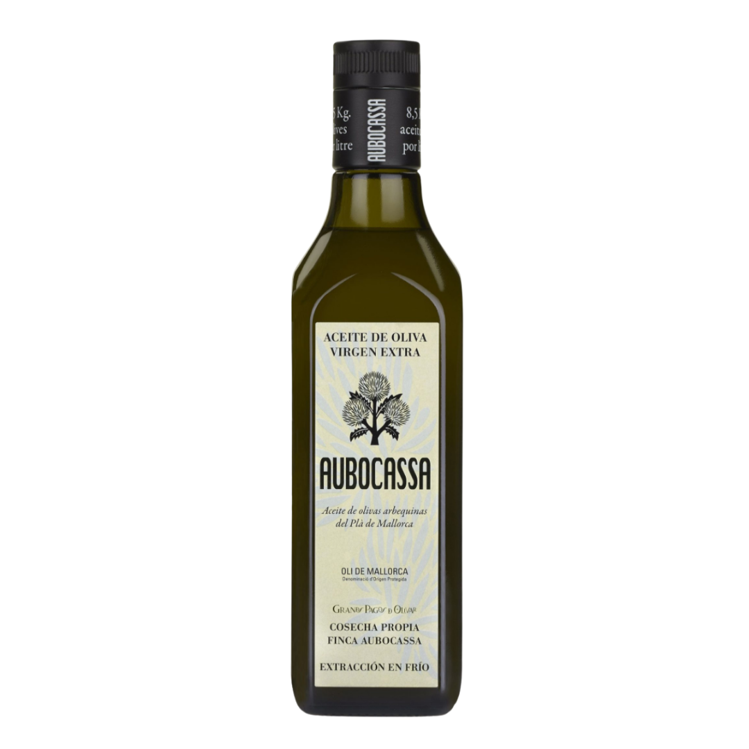 A bottle of Aubocassa Extra Virgin Olive Oil, crafted from arbequina olives in Mallorca. Elegant label design with detailed D.O. (Denomination of Origin) credentials and cold-extraction technique highlighted.