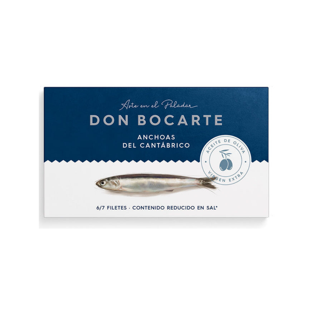 A sleek box of Don Bocarte anchovies from the Cantabrian Sea. The design features a minimalist fish graphic and highlights extra virgin olive oil and reduced salt content. Contains 6–7 premium fillets.