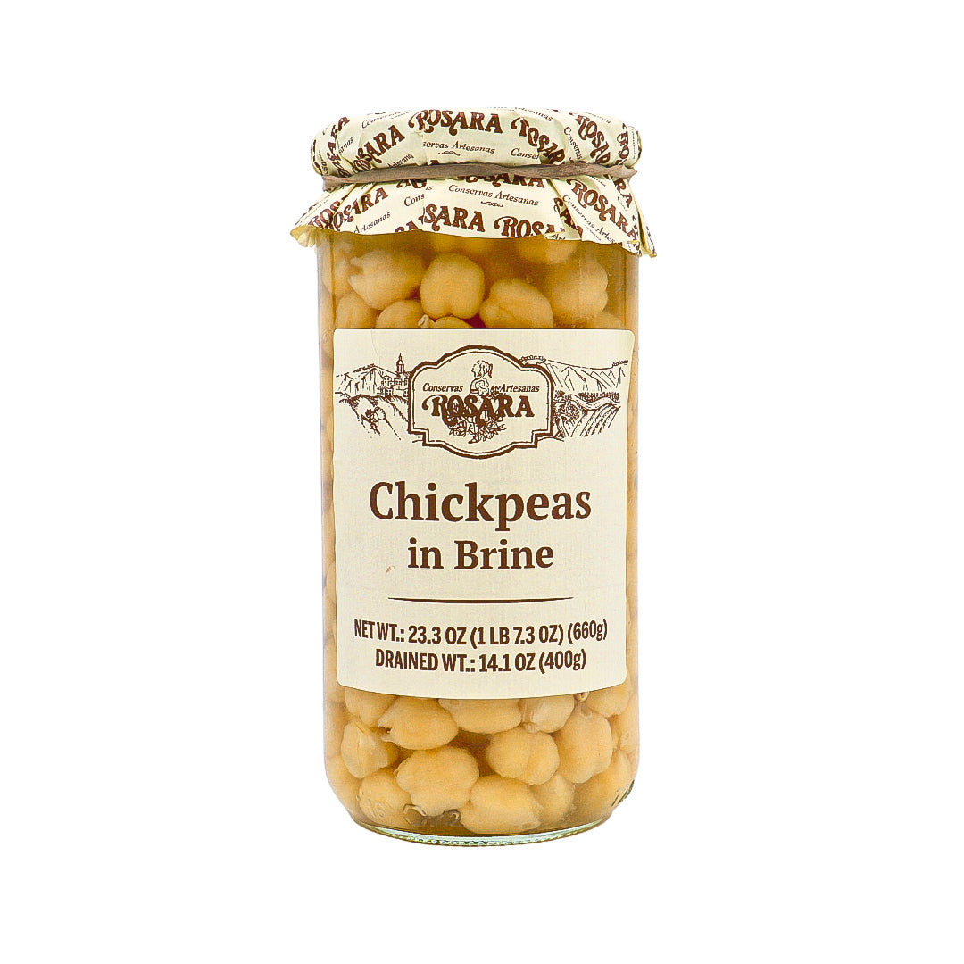 A glass jar of Rosara Chickpeas in Brine, showcasing tender Spanish garbanzo beans preserved in a natural brine. The artisanal label and visible legumes highlight the high quality and traditional craftsmanship of this pantry essential, ideal for gourmet Mediterranean dishes.