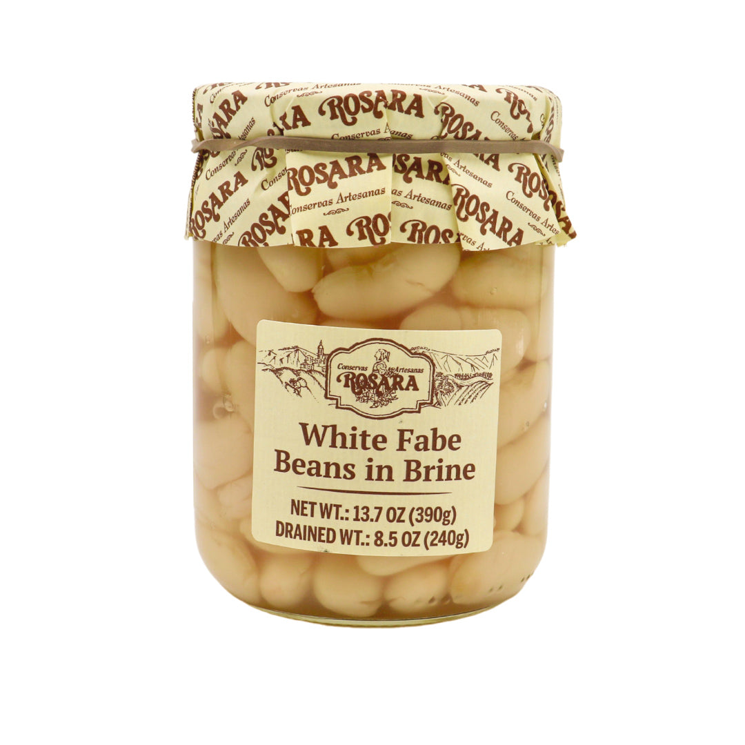 A jar of Rosara White Fabe Beans in Brine features tender Spanish white beans preserved in liquid. The artisanal-style label and branded paper lid reflect Rosara’s gourmet heritage, highlighting quality legumes ideal for traditional Spanish dishes.