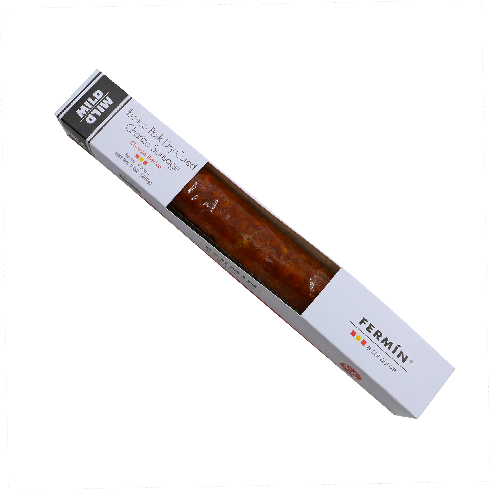 A diagonally positioned package of Fermin Iberico Pork Dry-Cured Chorizo Sausage. The packaging is rectangular with a white exterior and clear window displaying the reddish-brown chorizo inside. "MILD" is labeled on the top left corner, and "FERMÍN – a cut above" is printed on the right side along with the product name and weight (7 oz / 200g). The design conveys a premium Spanish cured meat product.