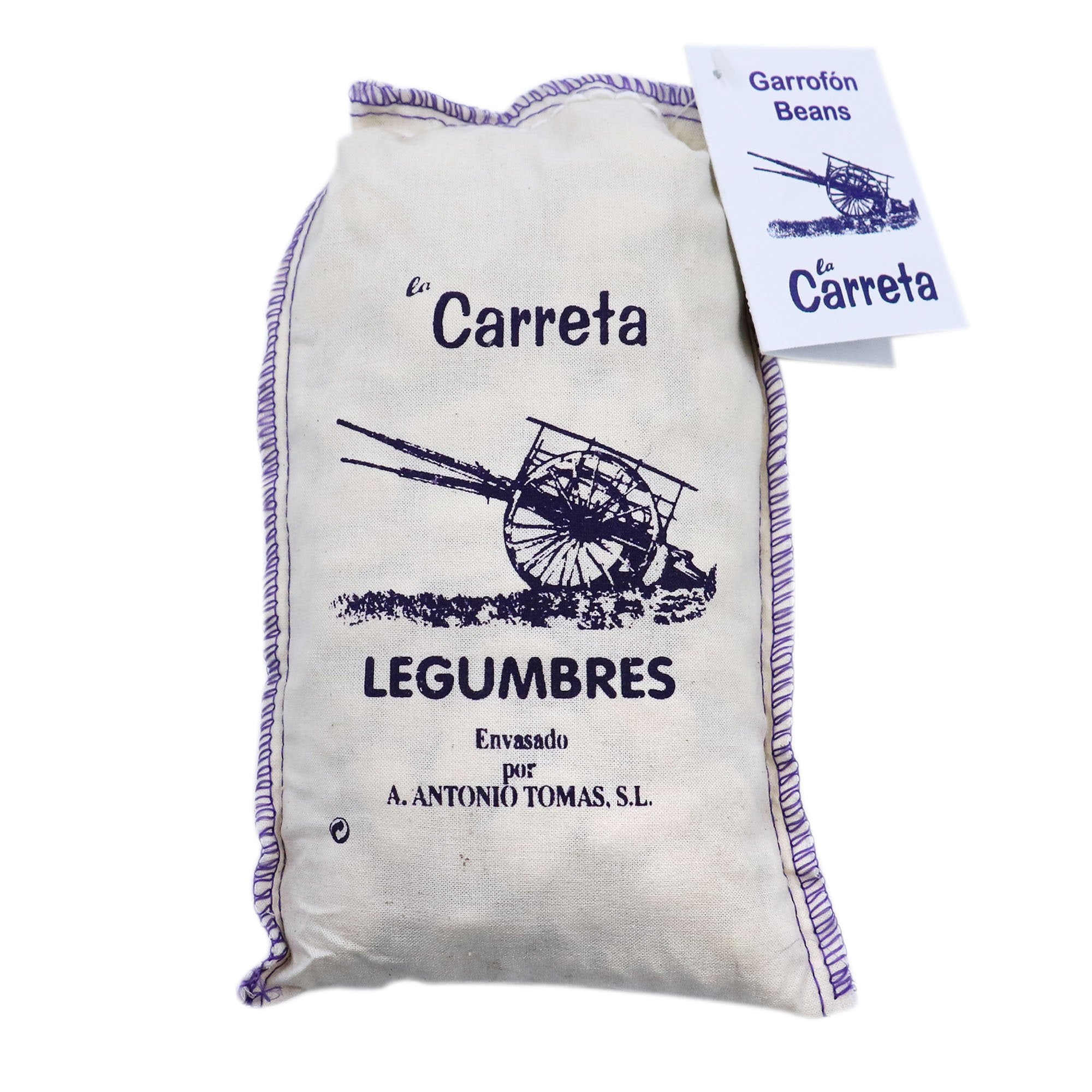 A cloth sack of La Carreta Garrofón Beans, traditionally packaged with a vintage-style cart illustration and stitched purple trim. This rustic Spanish legume is essential for authentic paella Valenciana and other Mediterranean dishes.