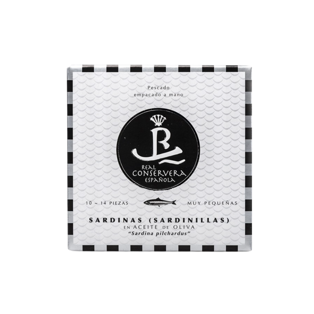 A sleek tin of Real Conservera Española Sardinillas showcases artisanal Spanish sardines in minimalist black-and-white packaging. The design mimics fish scales, highlighting hand-packed seafood, premium quality, and gourmet tradition from Galicia.