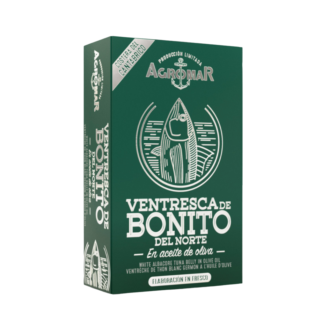 Box of Agromar Ventresca de Bonito del Norte, showcasing premium white albacore tuna belly in olive oil. The deep green packaging features a stylized tuna illustration and bold white lettering, emphasizing limited production and fresh, artisanal quality from Spain's Cantabrian coast.