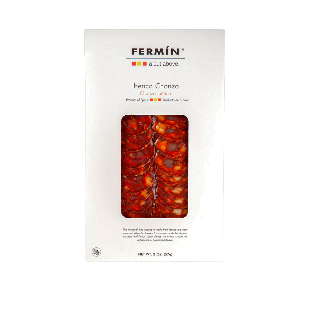 A sleek white package of Fermin Iberico Chorizo showcasing thinly sliced, richly marbled Spanish sausage. Crafted from Iberico pork, this gourmet product highlights traditional Spanish charcuterie and is perfect for tapas, cheese boards, and culinary gift sets.