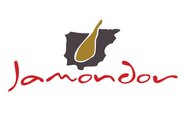 A stylized logo of "Jamondor" featuring the silhouette of Spain with a golden ham leg icon at its center, visually emphasizing the brand’s dedication to authentic Spanish cured meats.