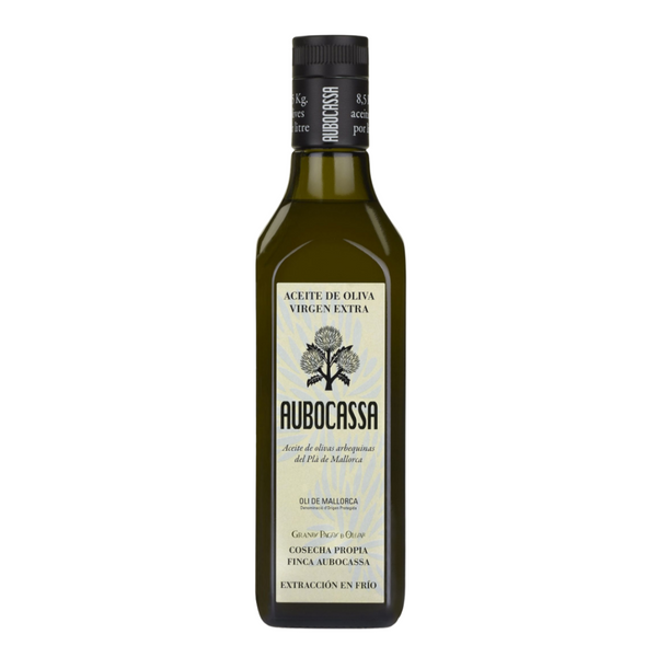 A bottle of Aubocassa Extra Virgin Olive Oil, crafted from arbequina olives in Mallorca. Elegant label design with detailed D.O. (Denomination of Origin) credentials and cold-extraction technique highlighted.