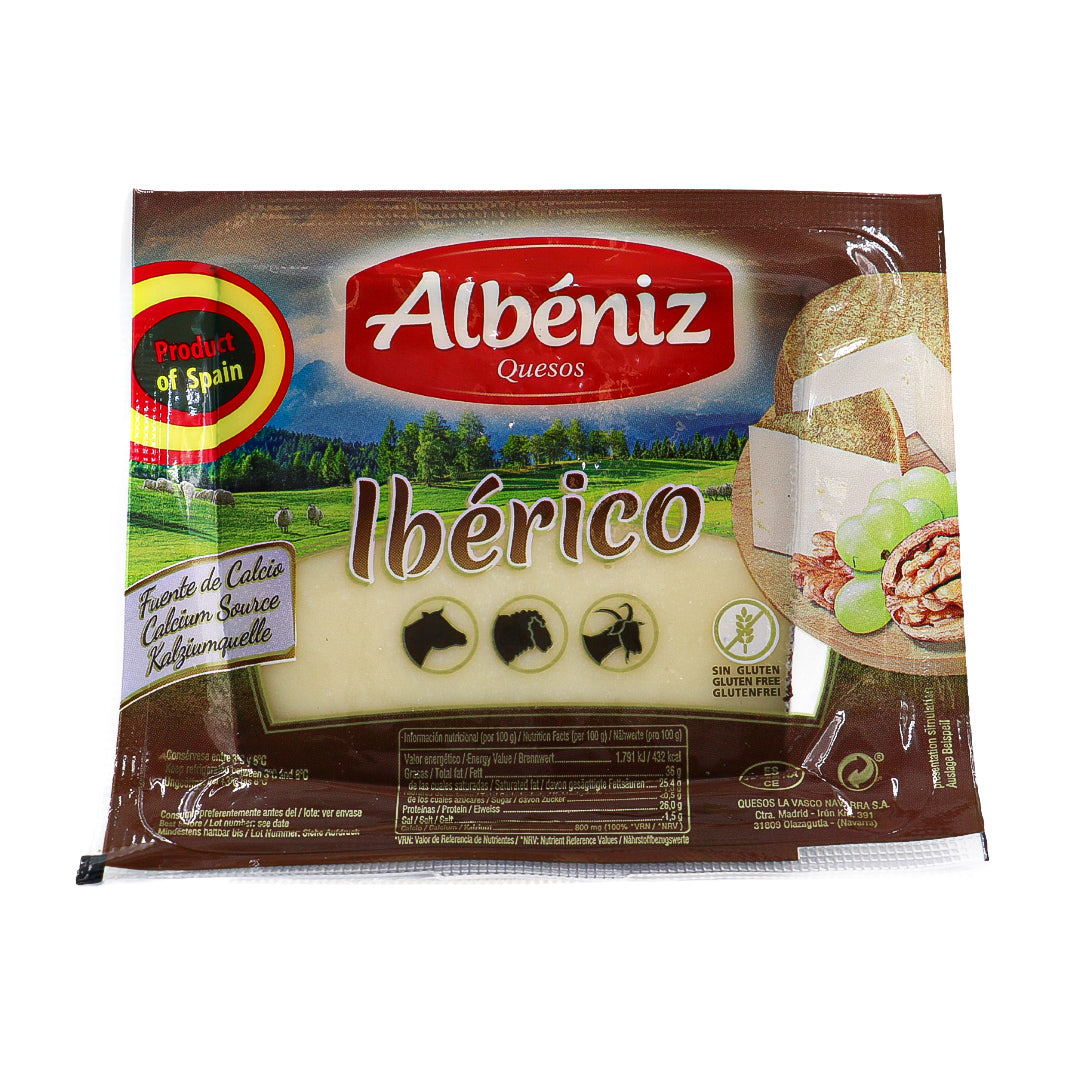 A front facing image of a pre-packed wedge of ibérico cheese from Spain. 